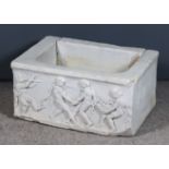 A Roman White Marble Child's Sarcophagus Fragment, the end deeply carved with four figures, two