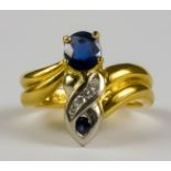 A Sapphire and Diamond Ring, Modern, 18ct gold, set with a central sapphire, approximately .50ct,