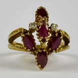 A Ruby and Diamond Cluster Ring, Modern, 14ct gold, set with five faceted rubies, approximately