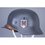 A German World War II Helmet, painted, with single decal