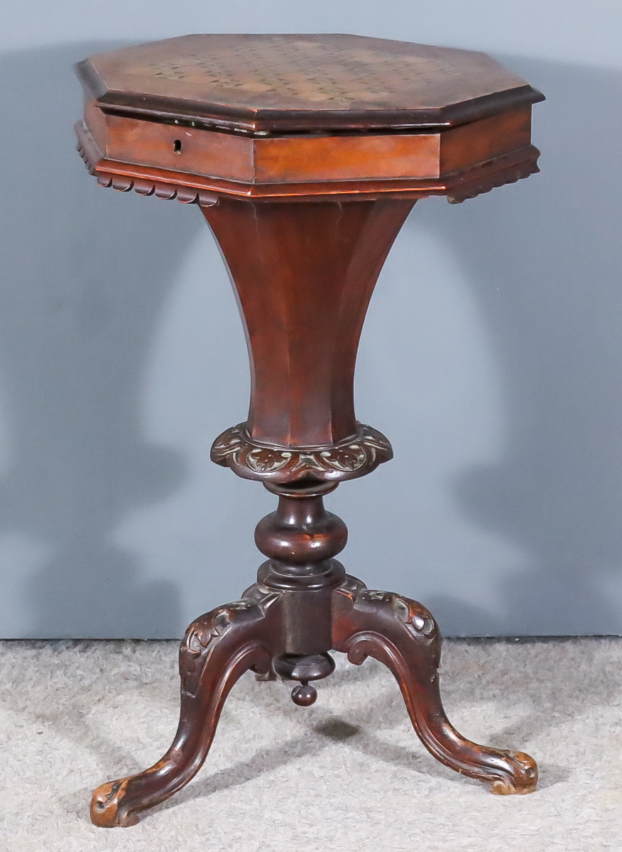 A Victorian Walnut and Rosewood Octagonal Work Table, the top inlaid with chessboard opening to