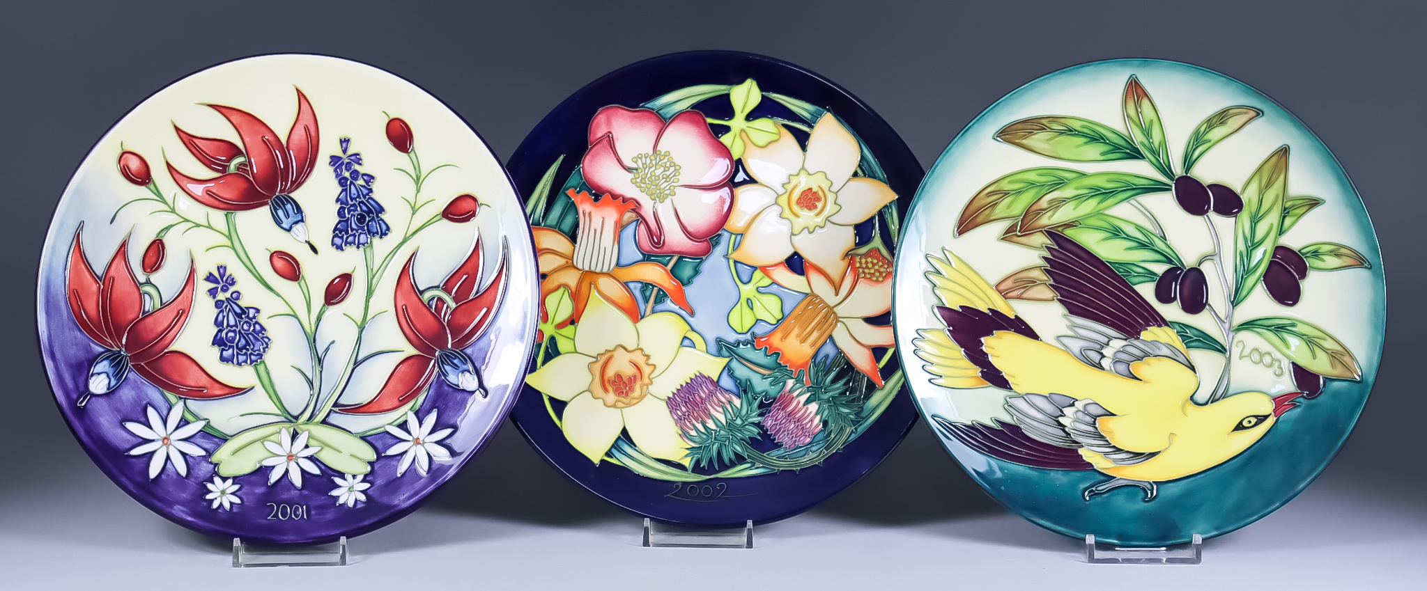 A Limited Edition Moorcroft Pottery Year Plate for 2001, No.1 of 750, 8.875ins diameter, a Golden