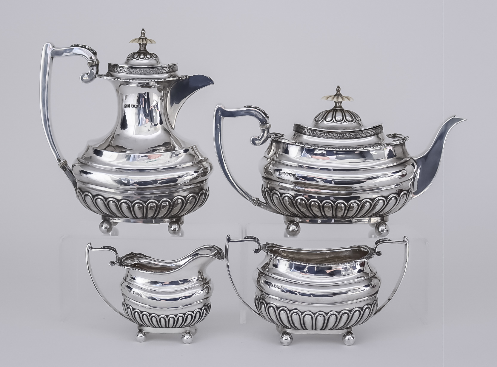 A George VI Silver Rectangular Four-Piece Tea Service, by Walker & Hall, Sheffield 1937 and 1951,