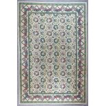 A Modern Needlework Carpet of "Aubusson" Design, woven in colours of fawn, blue, green and rose,