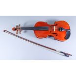 A Three Quarter Size Violin, 20th Century, with two piece back, the back 13ins (excluding button),