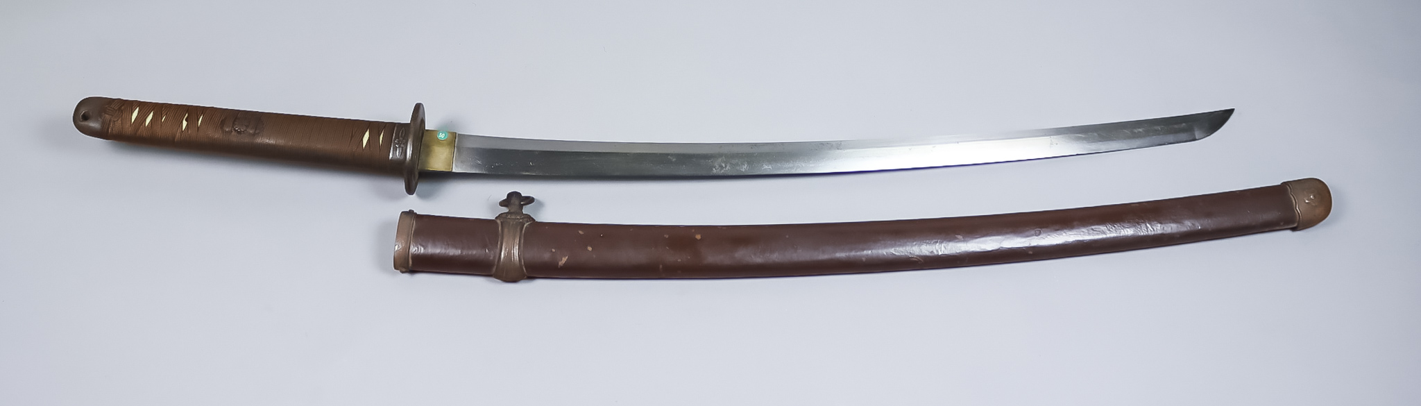 A World War II Japanese Katana, Showato blade in 1944 pattern mounts, dated March 1944