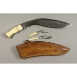 A Good 20th Century Broad Leaf Kukri, No. 899, in substantial leather scabbard, fitted with bone