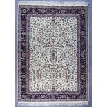 A Kashan Carpet, Early to Mid 20th Century, woven in ivory, fawn and navy blue, the field filled