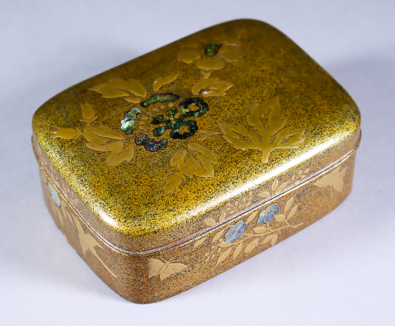 A Japanese Gold Nashiji Lacquer Incense Box, Taisho Period, the cover and sides decorated in high