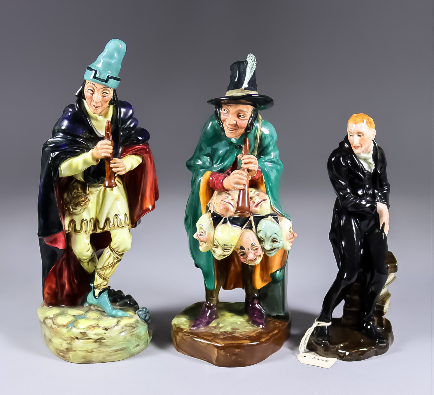 Three Royal Doulton Pottery Figures - "Uriah Heep" (HN554), 7ins high, "The Pied Piper" (HN2102),