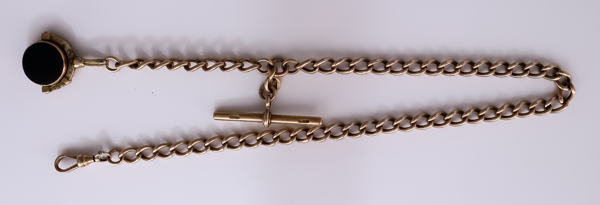 A 9ct Gold Albert Watch Chain, suspended with a 9ct gold blood stone charm, 340mm overall, gross