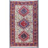 A Modern Soumak Rug of "Persian" Design, woven in colours with three bold shaped medallions, the