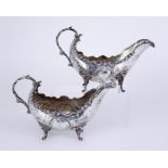 Two Continental Silvery Metal Oval Sauce Boats of Large Proportions, with floral and scroll cast