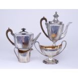A George III Harlequin Silver Rectangular Four-Piece Tea and Coffee Service, by Henry Chawner and