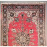 A Meshad Carpet, Early to Mid 20th Century, woven in colours with central star shaped medallion