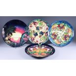 A Moorcroft Pottery Year Plate for 1998, No. 570 of 750, a year plate for 1999, No. 337 of 750,