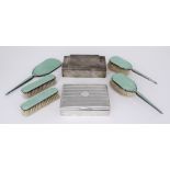 A George VI Silver and Green Enamel Backed Five-Piece Dressing Table Set and Two Silver Cigarette