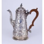 A Georgian Silver Coffee Pot, hallmarks rubbed but thought to be London, the tapered body embossed