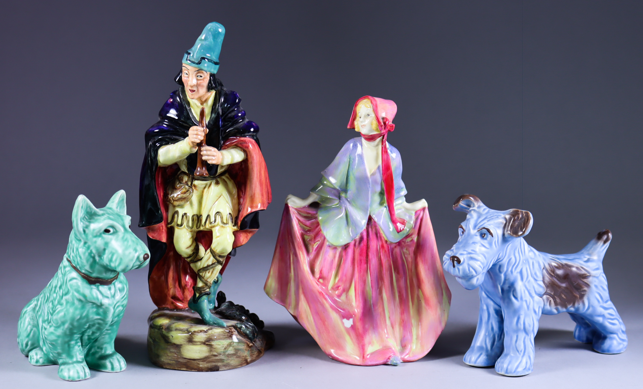 A Royal Doulton Pottery Figure of the Pied Piper, 8.25ins high, (HN2102), an early Royal Doulton