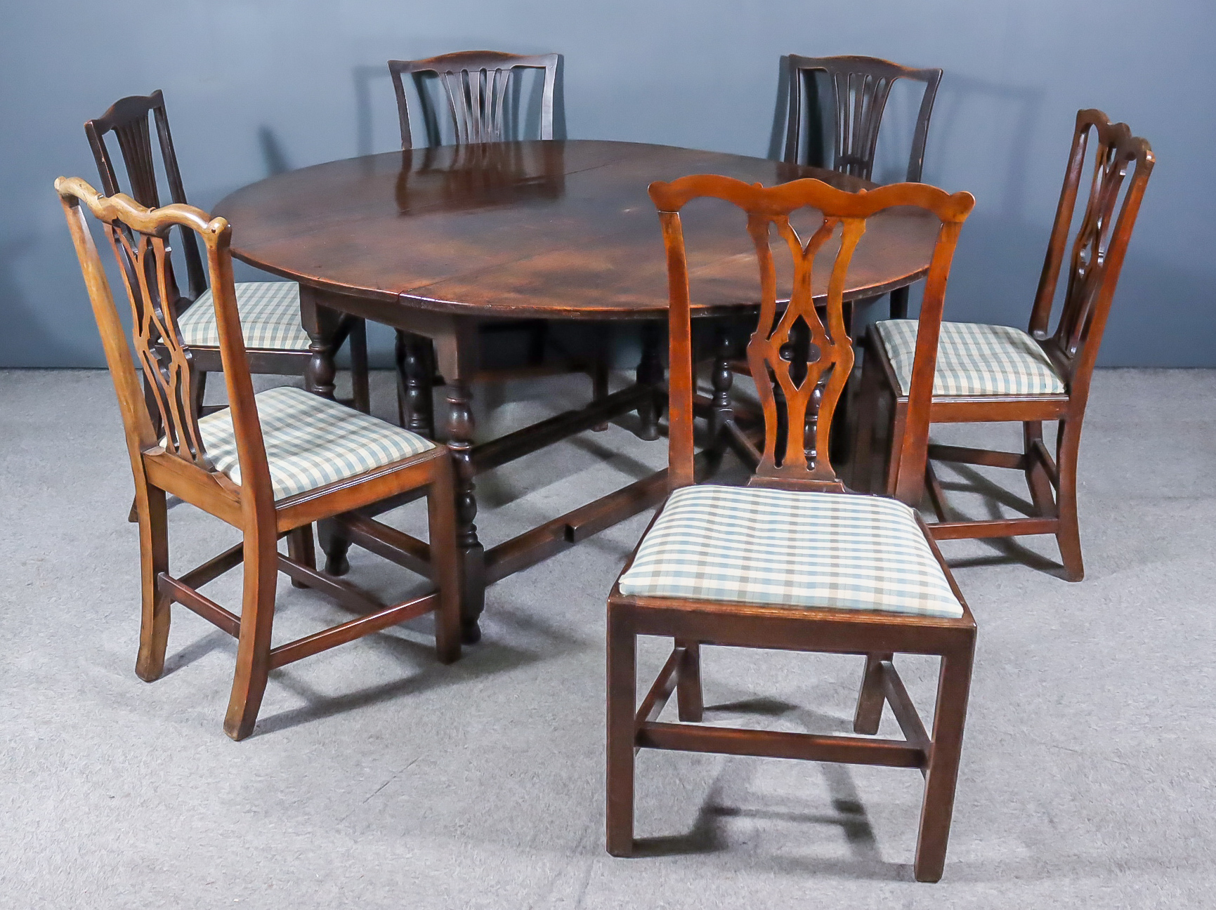 A 17th Century Oak Oval Gateleg Table, on baluster turned supports with turned feet, 56ins x 64ins x