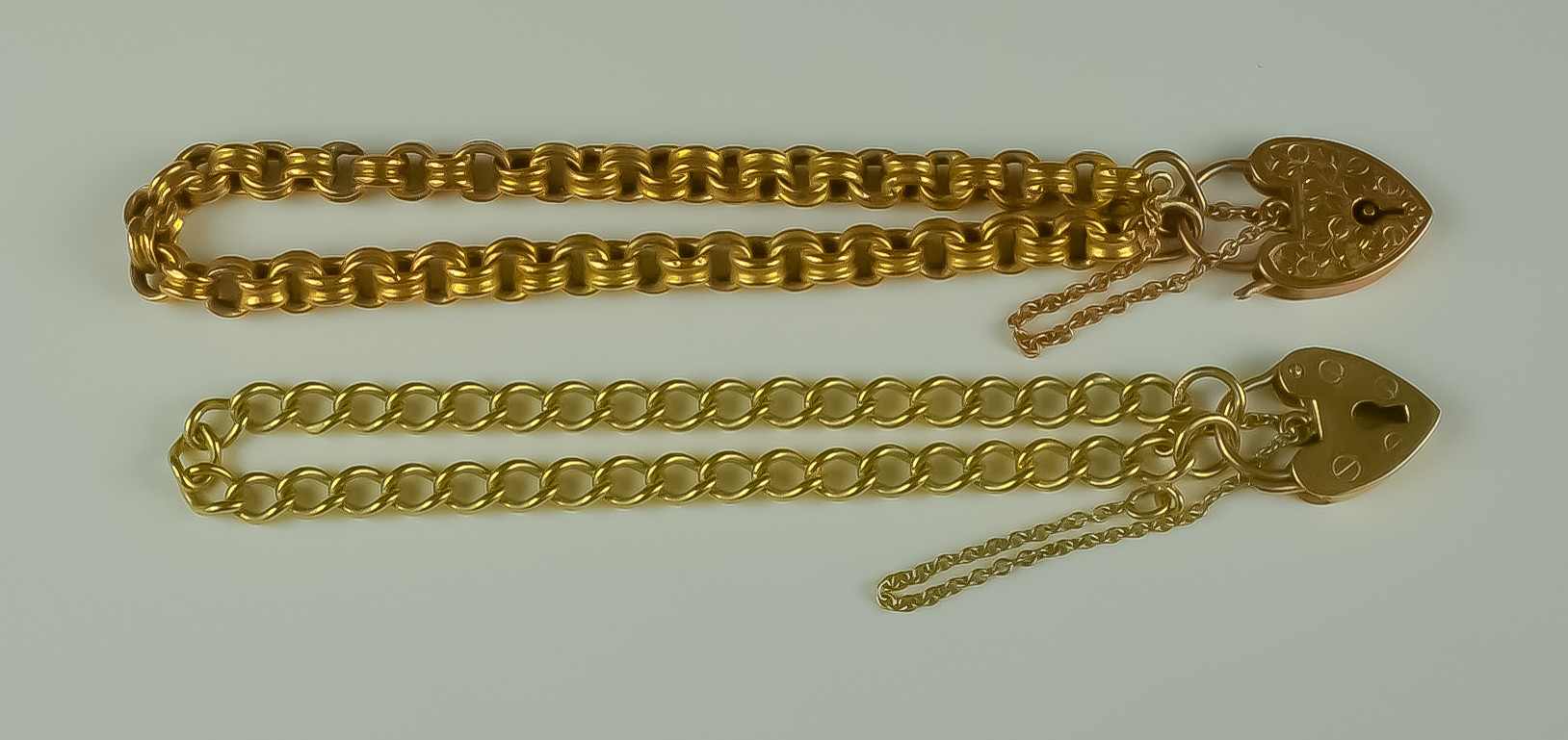 Two 9ct Gold Bracelets, Modern, each with heart padlock clasps, 140mm and 180mm overall, total gross