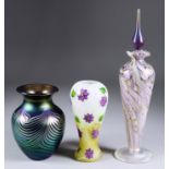 An Okra Studio Glass Perfume Bottle, 2005, with "Waves" design, 10ins high, a vase with "Clematis"