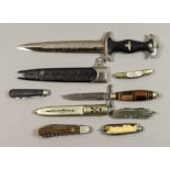 A Quantity of Edge Weapons comprising three early throwing knives, one reproduction World War II
