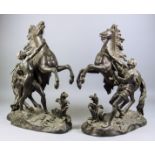After Guillaume Coustou (1677-1746) - A pair of late 19th Century French bronzed spelter figures