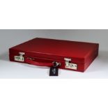 An Attache Case by Simpson of London, in red English leather, 16ins x 12ins, unused but shop