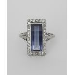 A Sapphire and Diamond Ring, Modern, 18ct white gold set with an unusual oblong sapphire,