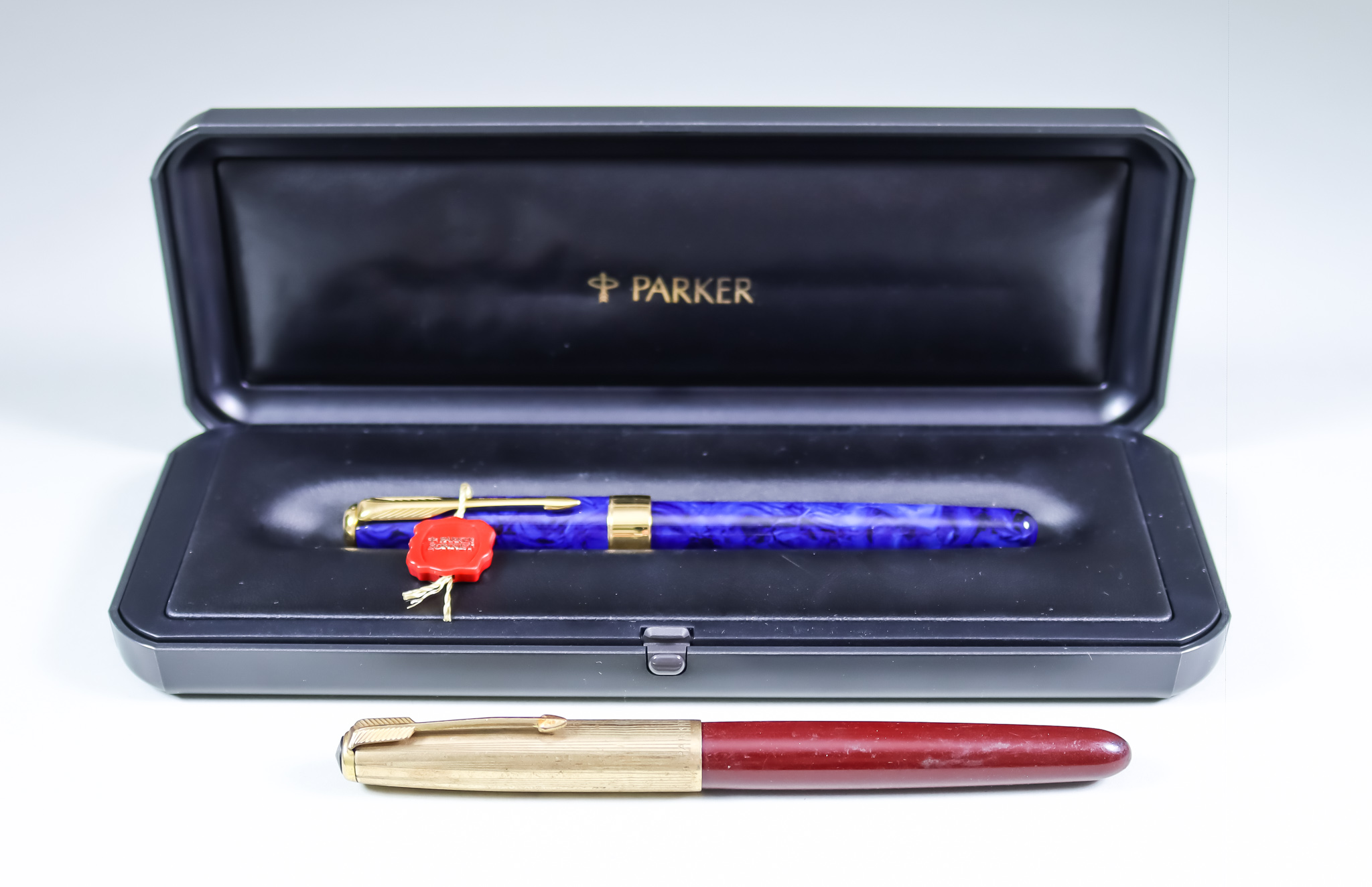 Two Parker Fountain Pens, comprising - a Sonnet Premium pen finished in blue lacquer, with