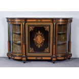 A Late Victorian Ebonised, Satinwood and Gilt Brass Mounted Credenza, with bowed ends, the whole