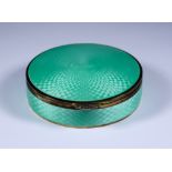 An Early 20th Century Silver Gilt and Green Enamel Circular Box, import marks HC Freeman Ltd. London