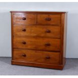 A Victorian Mahogany Chest with rounded front corners and moulded edge to top, fitted two short