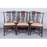 A Set of Six Mahogany Dining Chairs of "Country Chippendale" Design, with fretted vase pattern