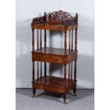 A Victorian Rosewood Rectangular Three-Tier Whatnot, with fretted gallery to top, on turned