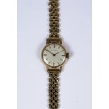 A Lady's Rotary Manuel Wind Wristwatch, 9ct gold case, 21mm case, silver dial with gold baton