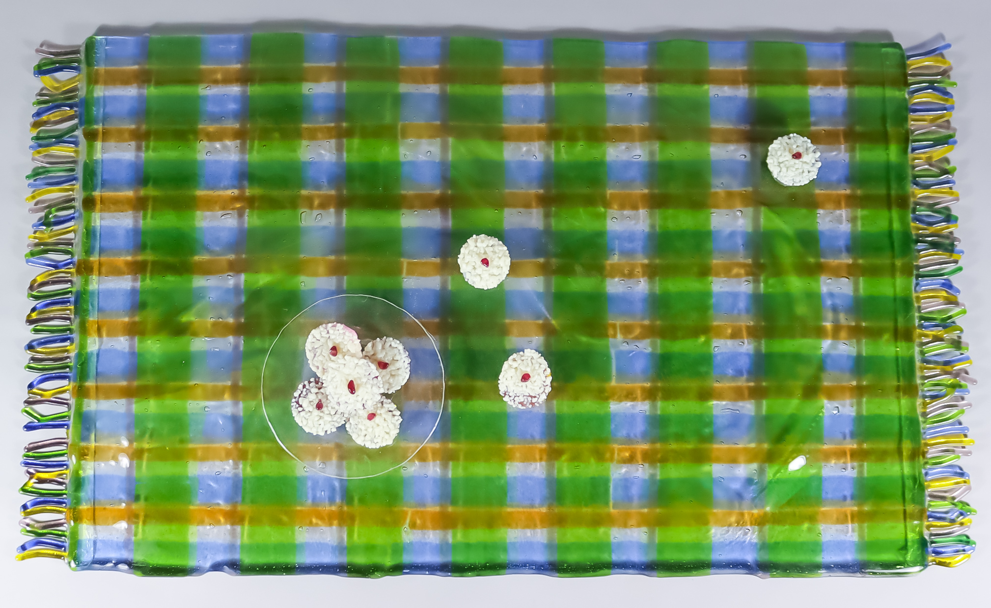 21st Century School - Glass sculpture of a tartan rug with a plate of and three scattered fancy