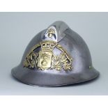 A French Steel Fireman's Helmet with brass crest - "Sapeurs Pompiers St Jean de Monts"