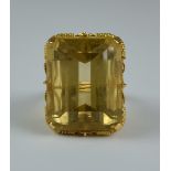 A Large Faceted Citrine Ring, yellow metal with filigree wire gallery, set with a large faceted