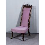 A Victorian Rosewood High Back Nursing Chair, with scroll cresting and slender turned uprights,