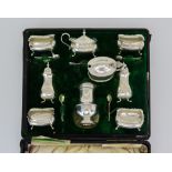 An Edward VII Silver Part Condiment Set, various makers, Birmingham 1905, with shaped rims,