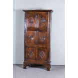 An Old Panelled Oak Hall Cupboard, with moulded cornice, enclosed by a single six-fielded panel