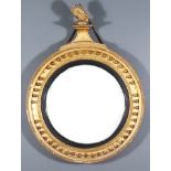An Early 19th Century Gilt Circular Convex Wall Mirror and a Gilt Circular Convex Girandole, each