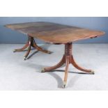 A 19th/20th Century Mahogany Two-Pedestal Dining Table of "George III" Design, with one extra