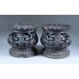 A Pair of Chinese Bronze Circular Stands, 19th/20th Century, cast with dragons, 5.5ins (14cm)