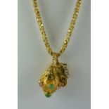 An 18ct Gold Chain, Modern, suspended with two gold coloured metal charms, one in the form of a mini