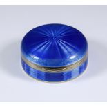 An Early 20th Century Continental Silver, Silver Gilt and Blue Enamel Circular Box, with import