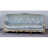 A French Gilt Framed Three Seat Settee of "Louis XV" Design,with shaped back upholstered in blue