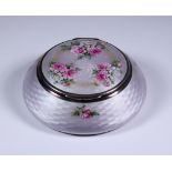 An Early 20th Century Silver, Silver Gilt and White Enamel Circular Box, Hallmarks rubbed but
